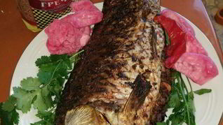 Сазан, запеченный с гречкой, по-астрахански